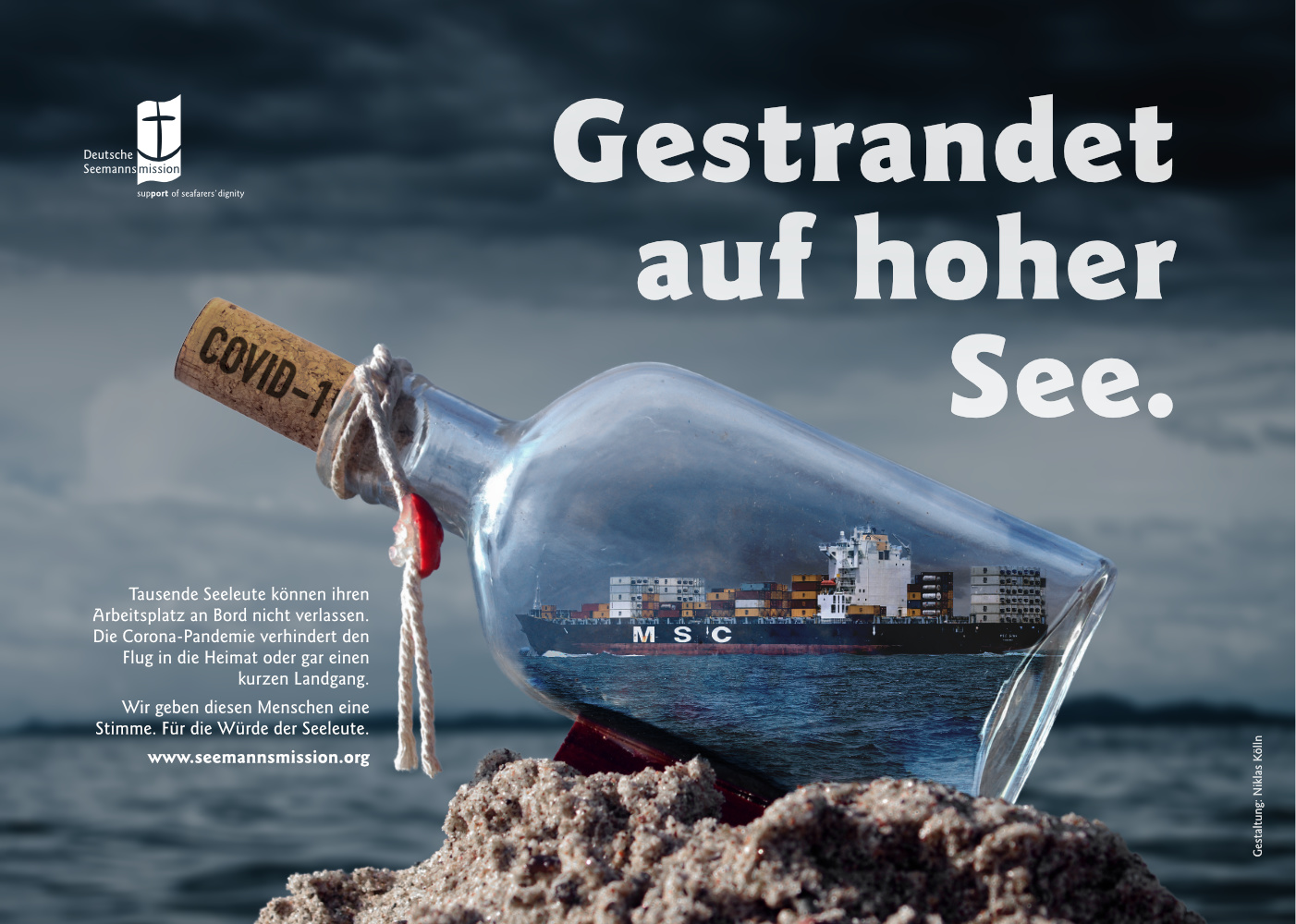 A container vessel is enclosed in a glass bottle, which is sealed by a cork. The cork has “Covid-19” written on it